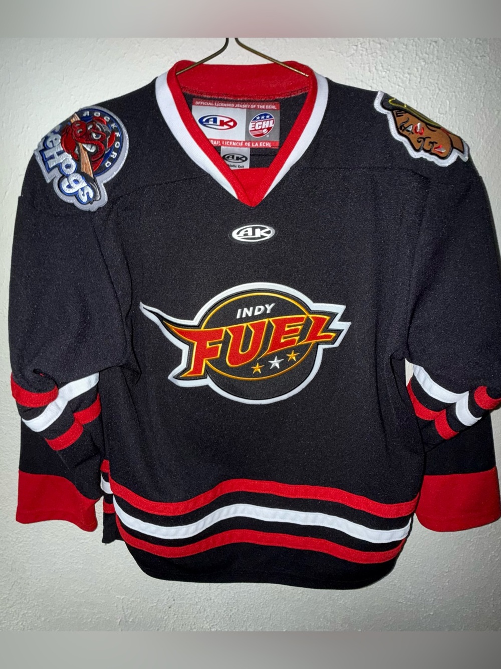 AK Indy Fuel Kids' Black Hockey Jersey with Red & White Accents